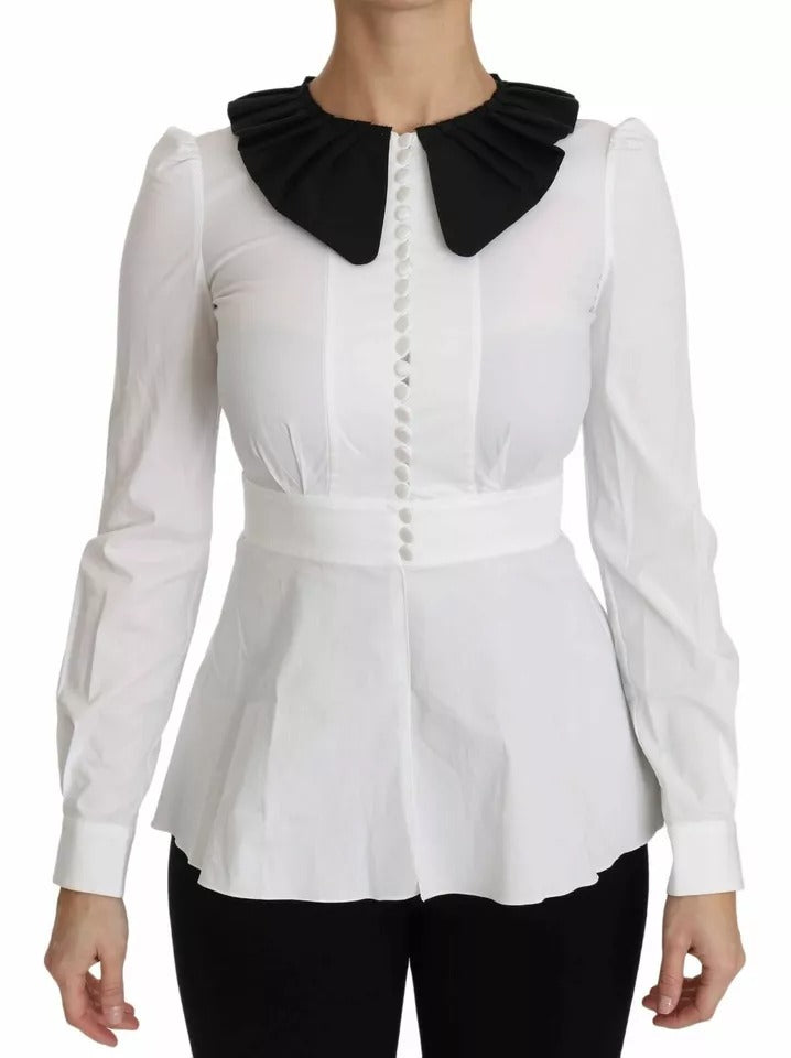 Boutons décoratifs noirs et blancs sur une chemise ou blouse Dolce & Gabbana, détails élégants sur le tissu.