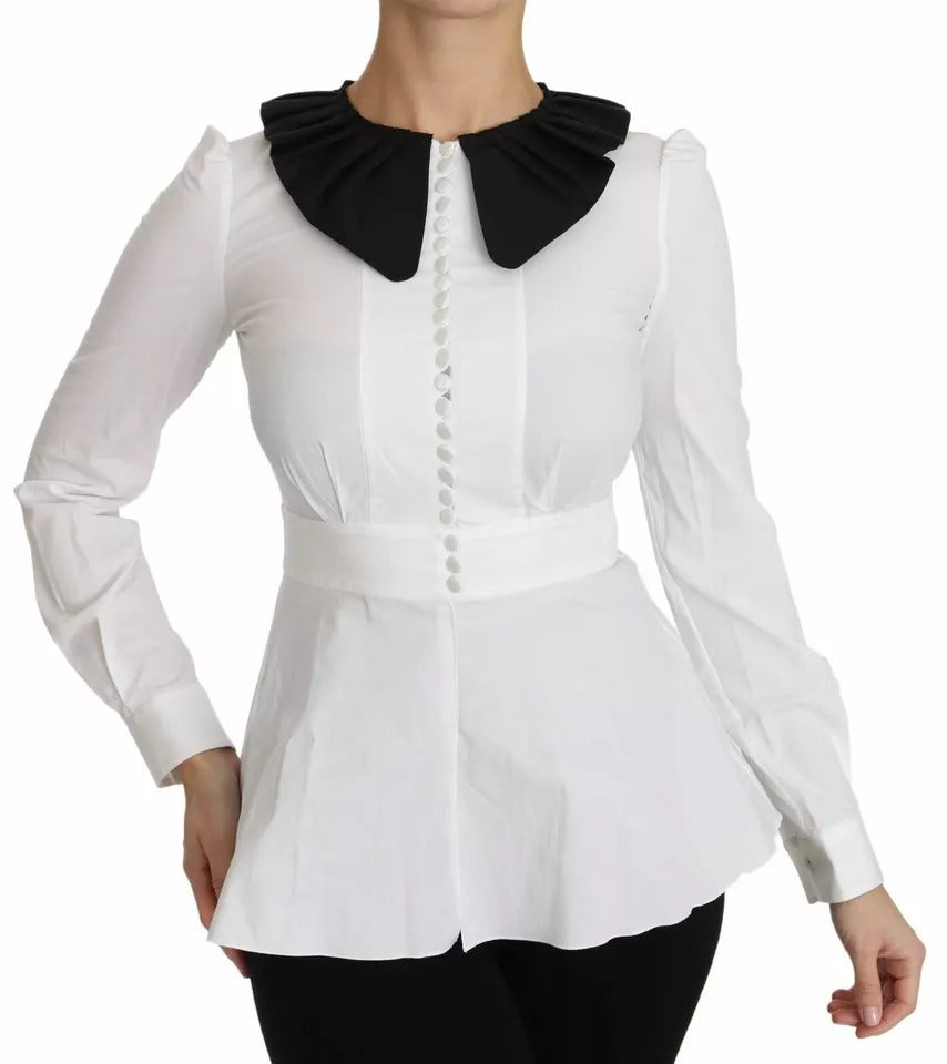 Boutons décoratifs noirs et blancs sur chemise ou blouse Dolce & Gabbana, détails élégants visibles sur le haut.