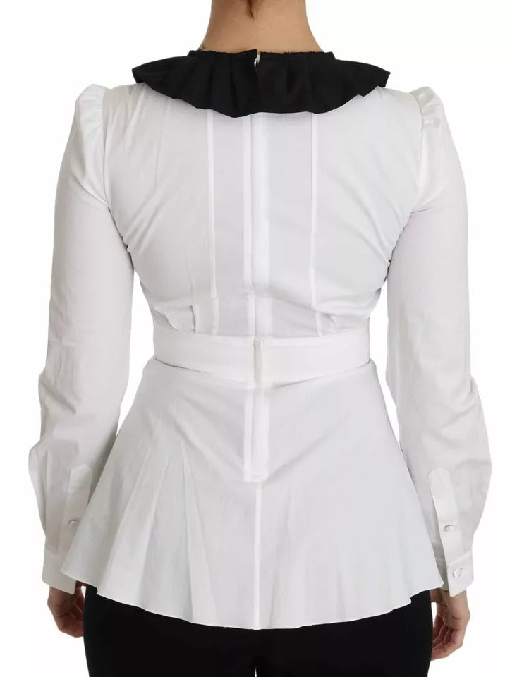 Boutons décoratifs noirs et blancs sur chemise ou blouse Dolce & Gabbana, détails élégants visibles sur la chemise.