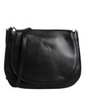 Sac à bandoulière en cuir noir Dolce & Gabbana avec rabat et boucle, vue de face sur un fond neutre.