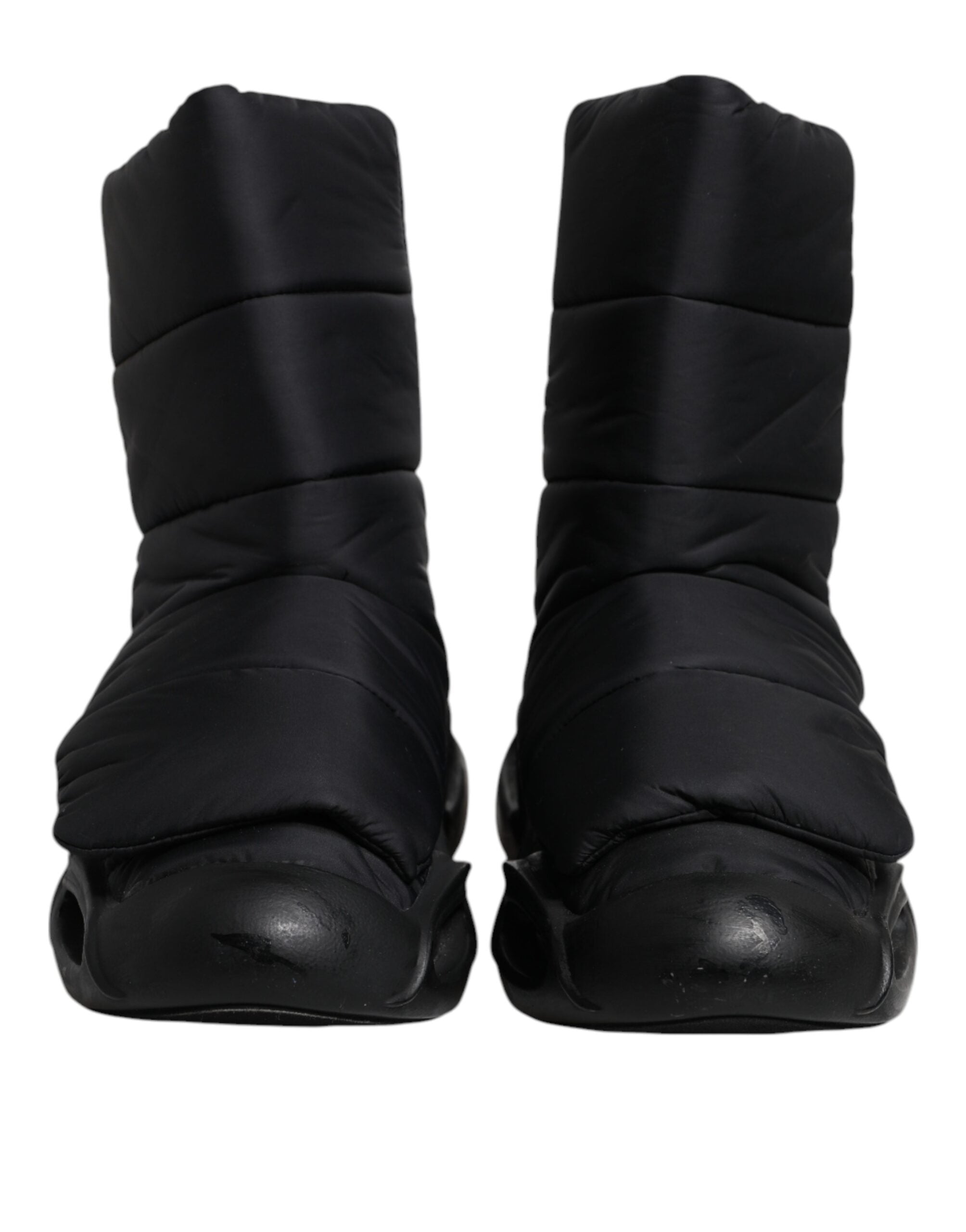 Chaussures Dolce & Gabbana baskets noires à enfiler avec motif ondulé matelassé, style élégant et moderne.