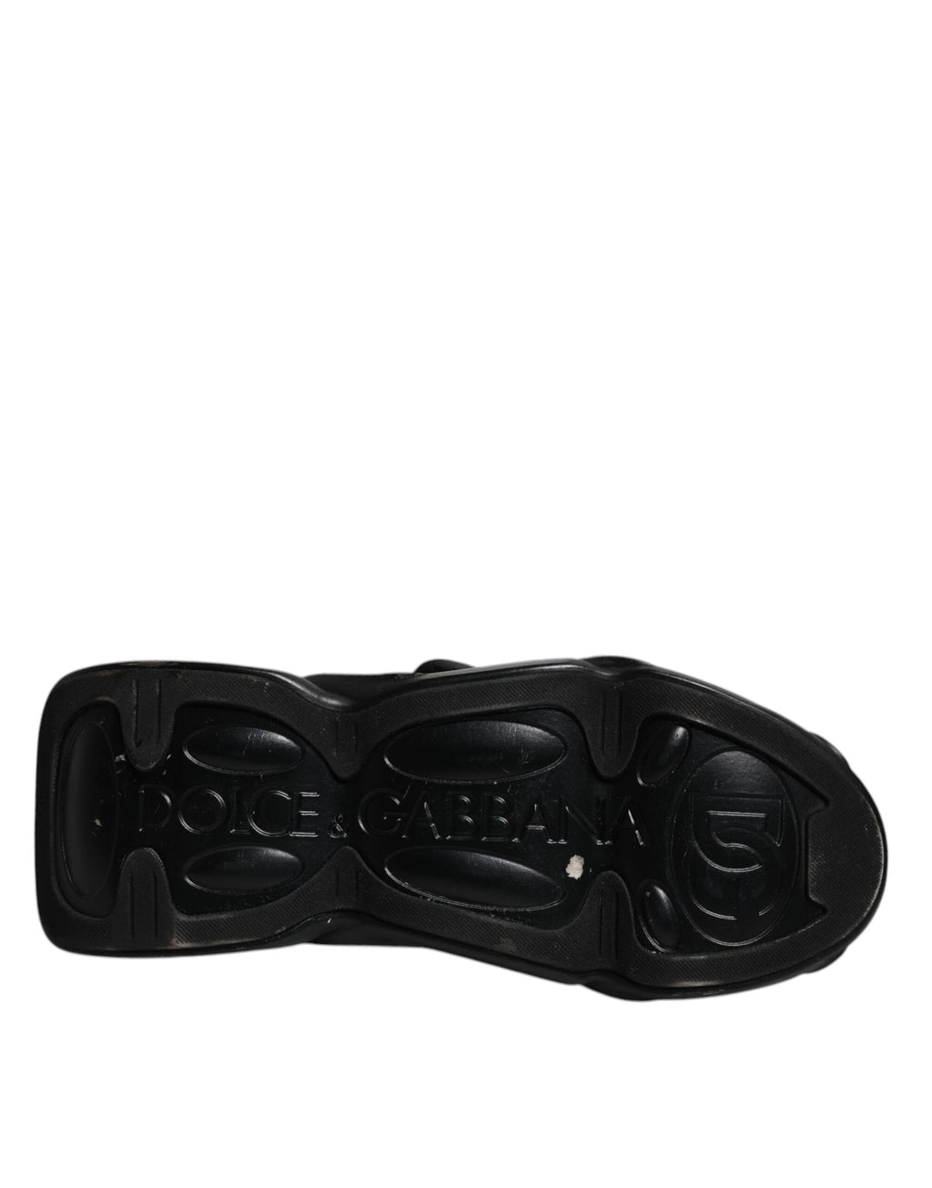 Chaussures Dolce & Gabbana sneakers slip-on noires avec motif ondulé matelassé, style décontracté et élégant.