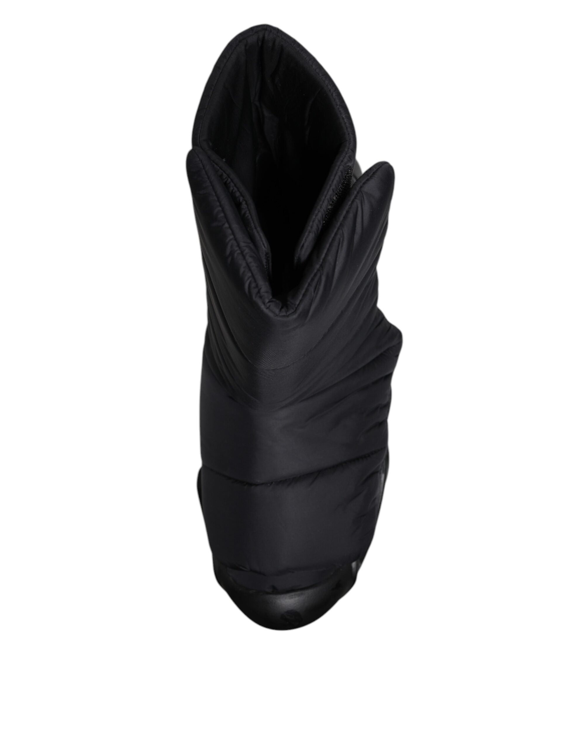 Chaussures Dolce & Gabbana sneakers slip-on noires avec motif ondulé matelassé, style élégant et moderne.