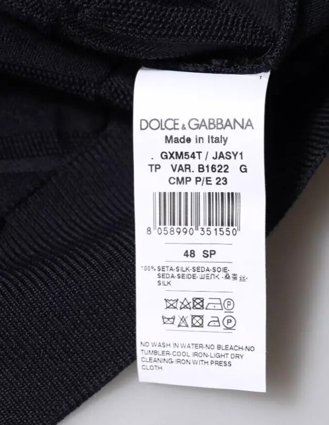 Pull homme Dolce & Gabbana en soie noire à col rond, cardigan élégant avec boutons visibles.
