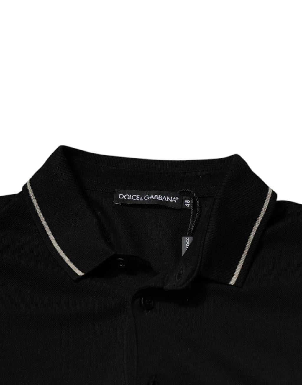 Polo à manches courtes Dolce & Gabbana, noir et blanc, en coton, vue de face, style élégant et classique.