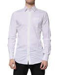 Chemise homme Dolce & Gabbana en coton blanc à manches longues avec détails dorés, élégante et sophistiquée.