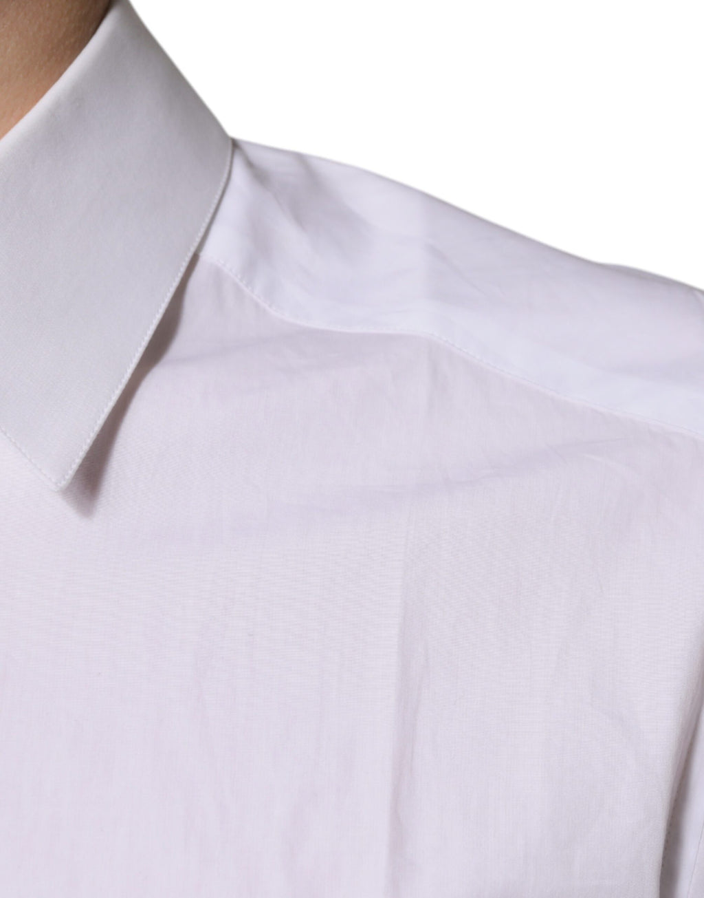 Chemise blanche en coton à manches longues Dolce & Gabbana avec détails dorés, élégante et sophistiquée.