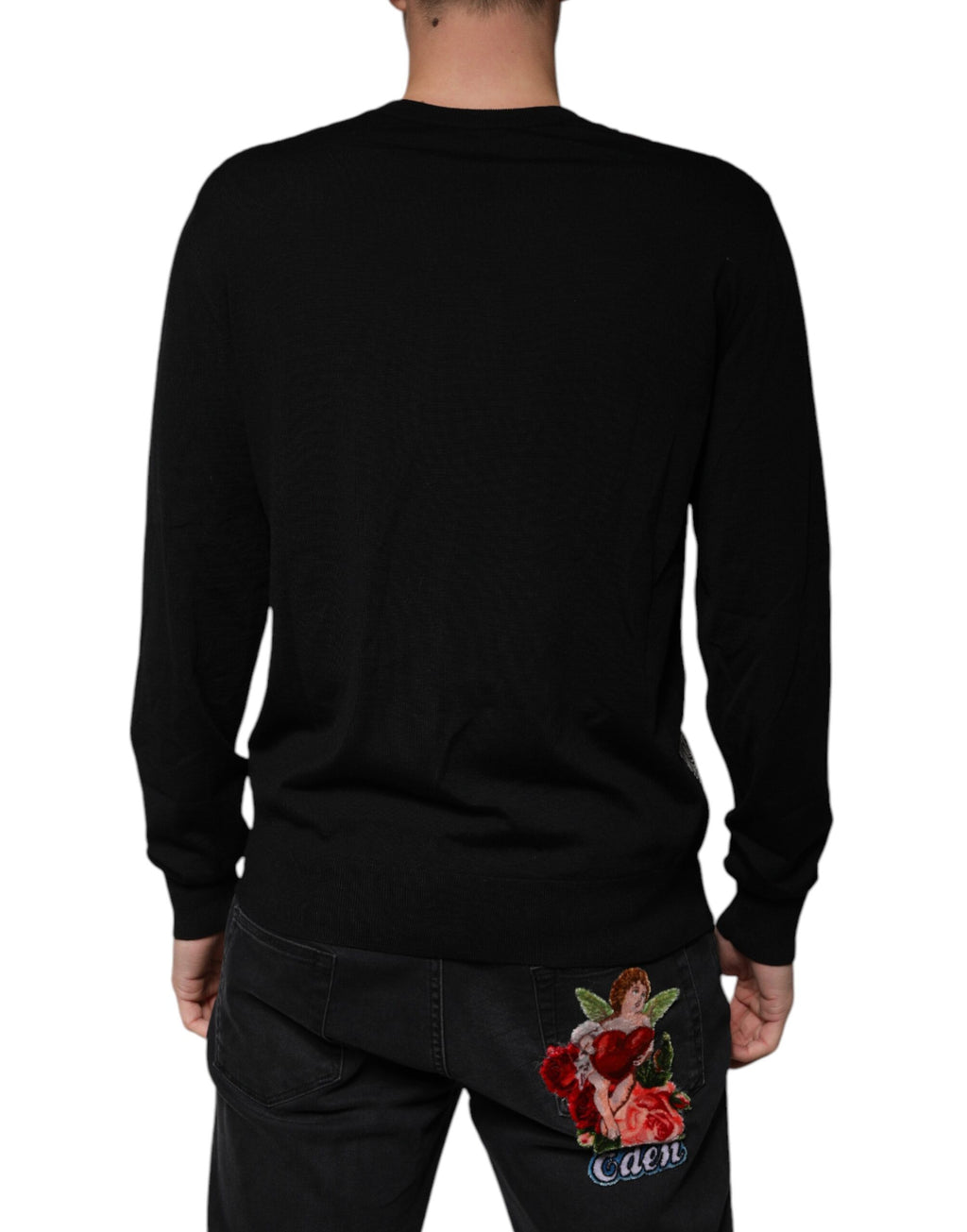 Pull en laine noir Dolce & Gabbana avec logo, col en V, style décontracté et élégant, visible en gros plan.