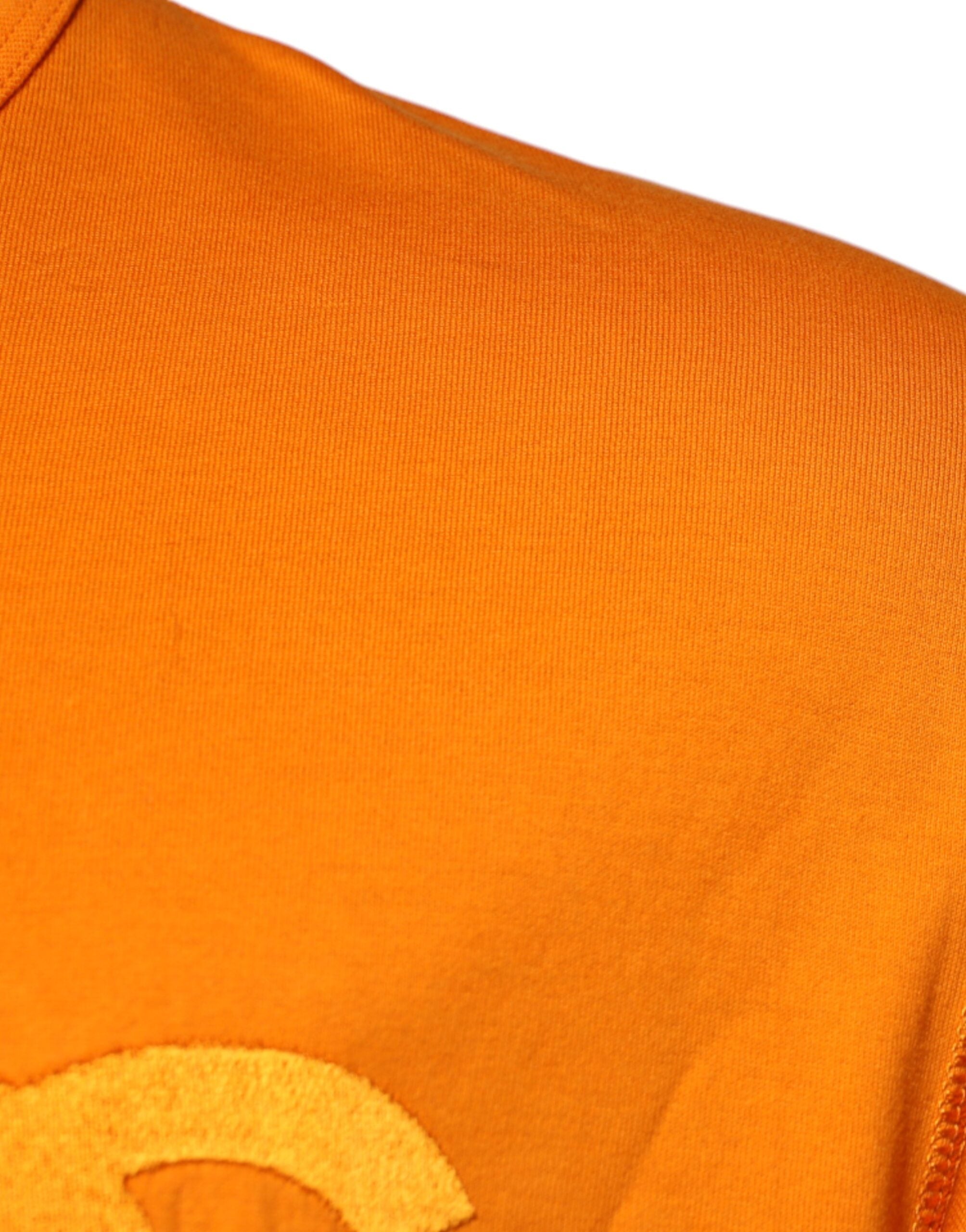 T-shirt en coton à logo orange Dolce & Gabbana avec col rond, vue de face, détails visibles sur le devant.