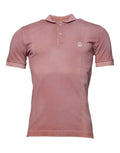 T-shirt polo à manches courtes rose Dolce & Gabbana avec col montant et logo de couronne sur la poitrine.