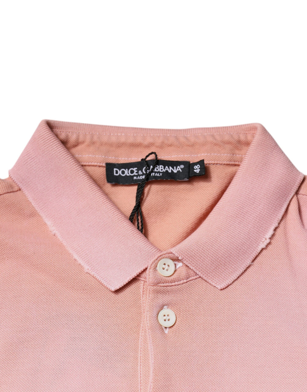 T-shirt polo à manches courtes rose Dolce & Gabbana avec col et motif couronne, élégant et stylé.