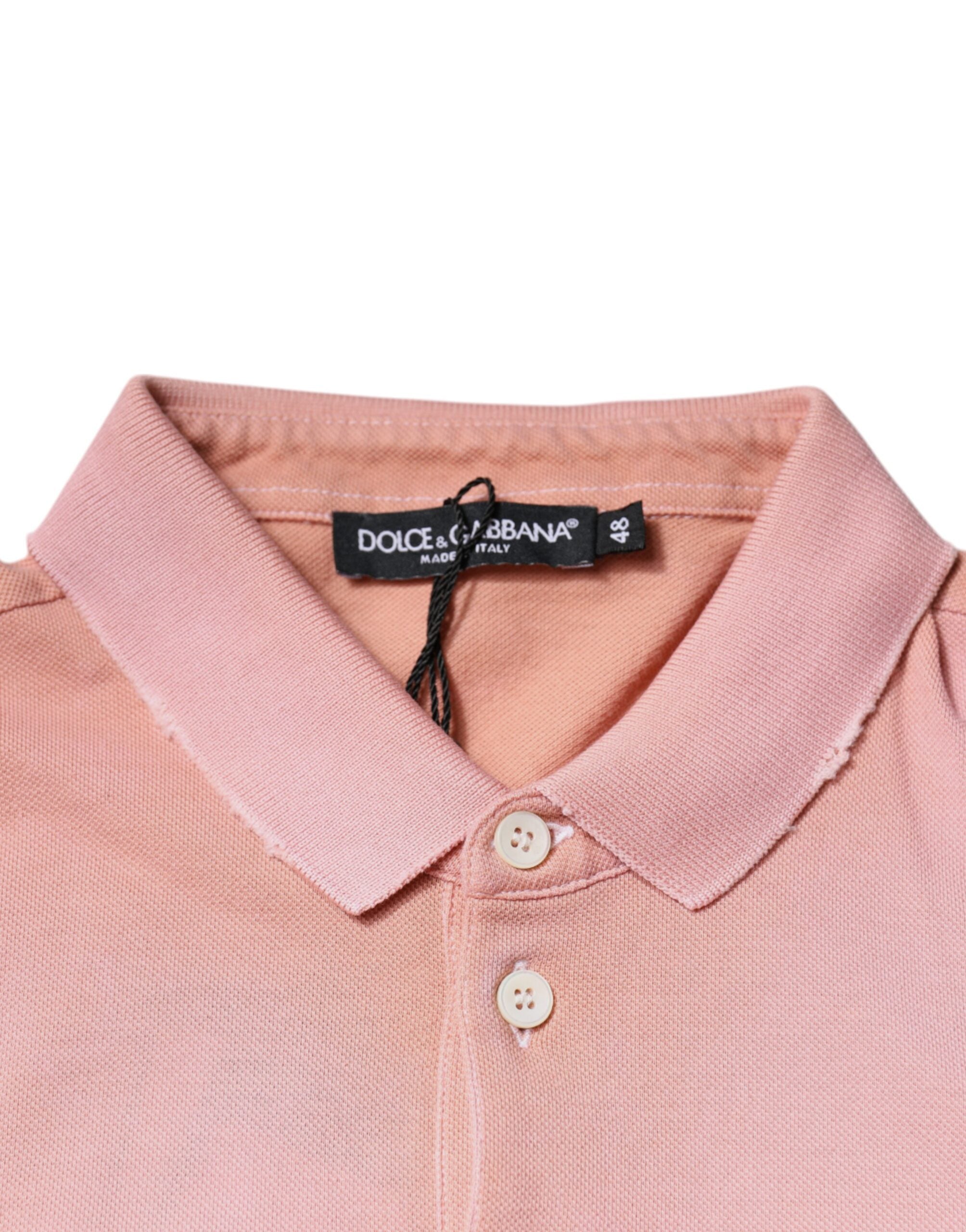T-shirt polo à manches courtes rose Dolce & Gabbana avec col et motif couronne, élégant et stylé.