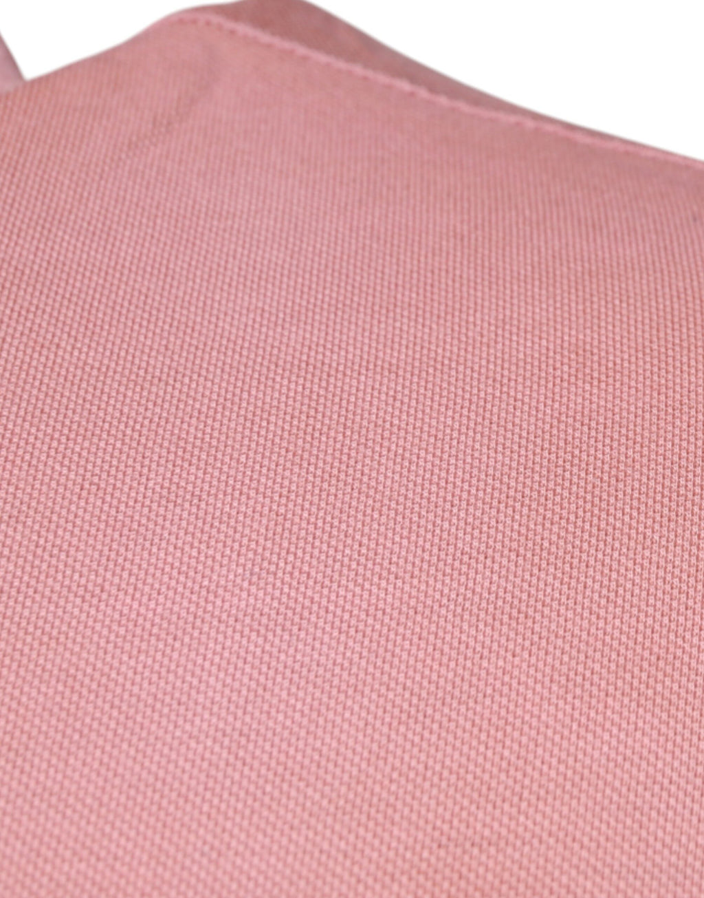 Polo à manches courtes rose Dolce & Gabbana avec col monté en forme de couronne, élégant et tendance.