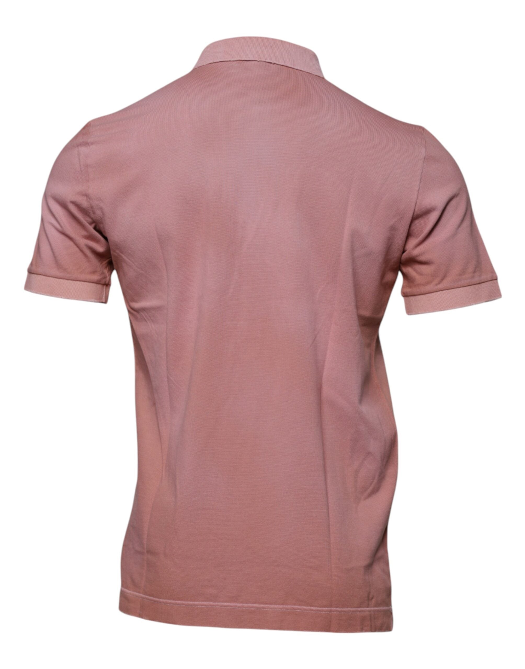 T-shirt polo Dolce & Gabbana rose avec col et manches courtes, ornée d'une couronne brodée rose.