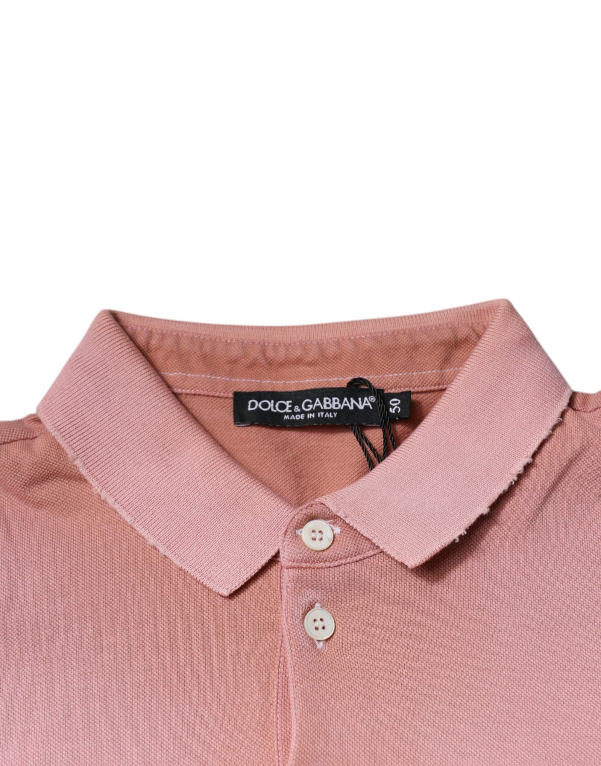 T-shirt polo à manches courtes Dolce & Gabbana rose avec col orné d'une couronne, style élégant et décontracté.