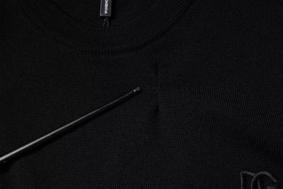 Pull noir Dolce & Gabbana en laine avec logo, col rond, pull-over élégant et chaud, vue de face.