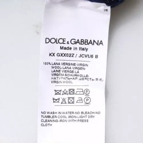 Pull à col rond en laine bleu Dolce & Gabbana avec logo DG visible sur le devant, style élégant et confortable.