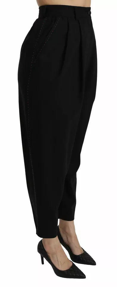 Pantalons cropped en laine noire Dolce & Gabbana avec taille haute et plis avant, vue de face.