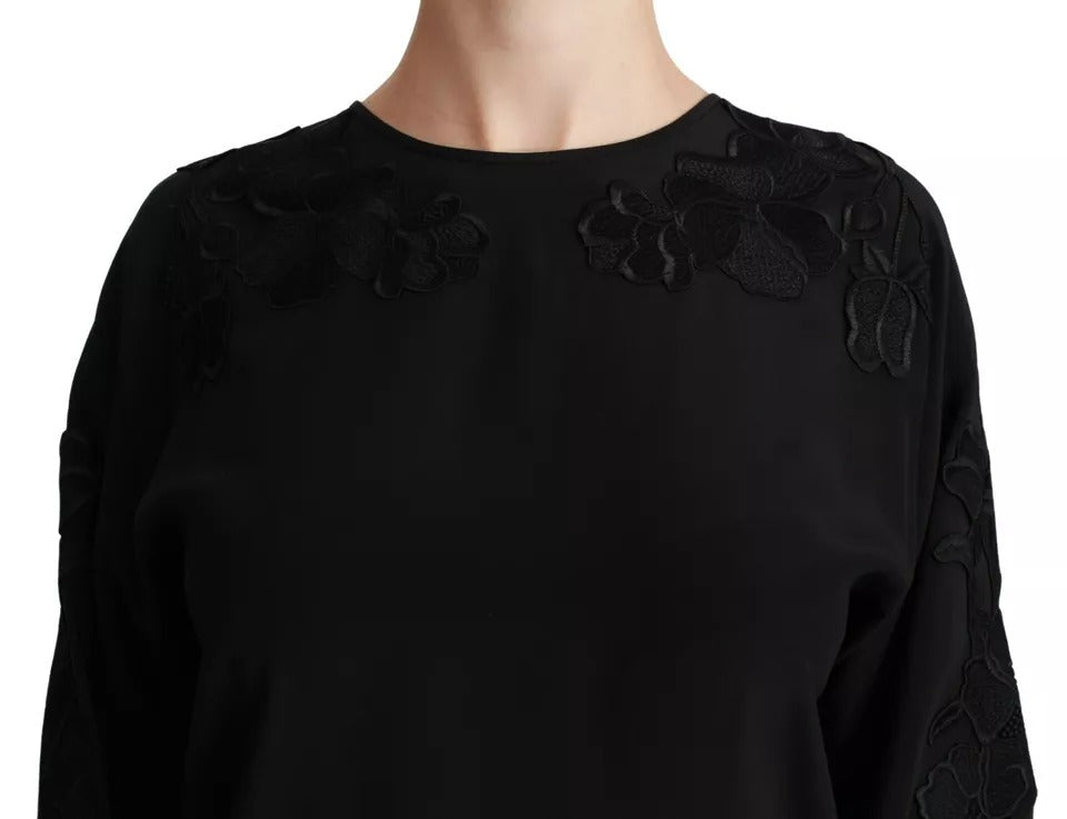 Chemisier en soie noir Dolce & Gabbana avec broderie florale élégante, détail sophistiqué et coupe classique.