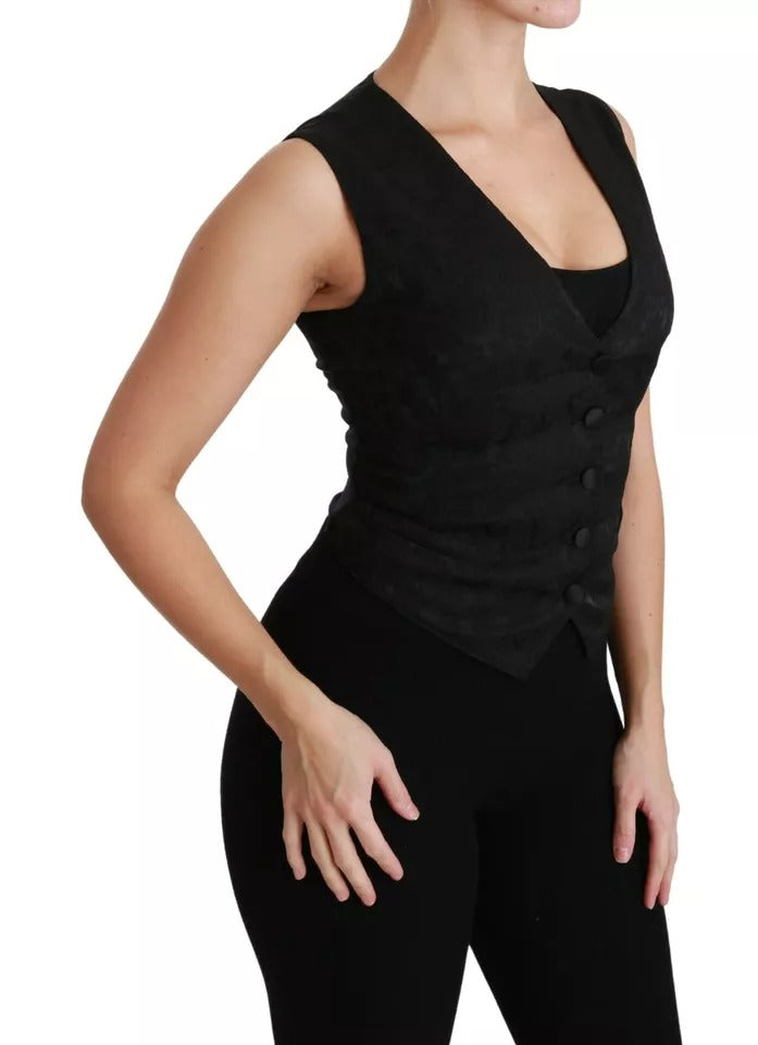 Gilet noir en dentelle Dolce & Gabbana, veste slim en soie avec détails élégants, porté sur un mannequin.
