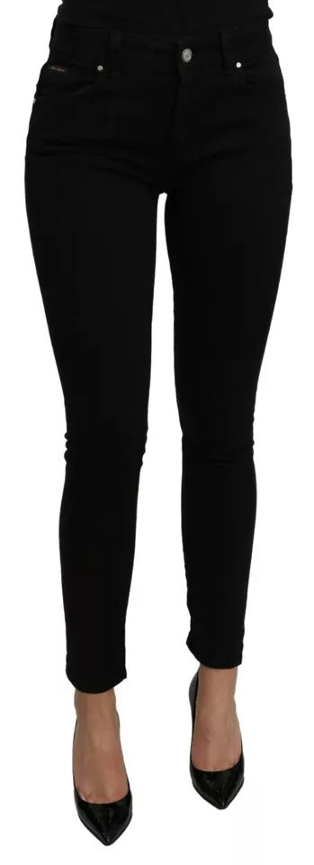 Jeans slim en coton stretch noir à taille mi-haute de Dolce & Gabbana, visible détail de la coupe et de la texture denim.