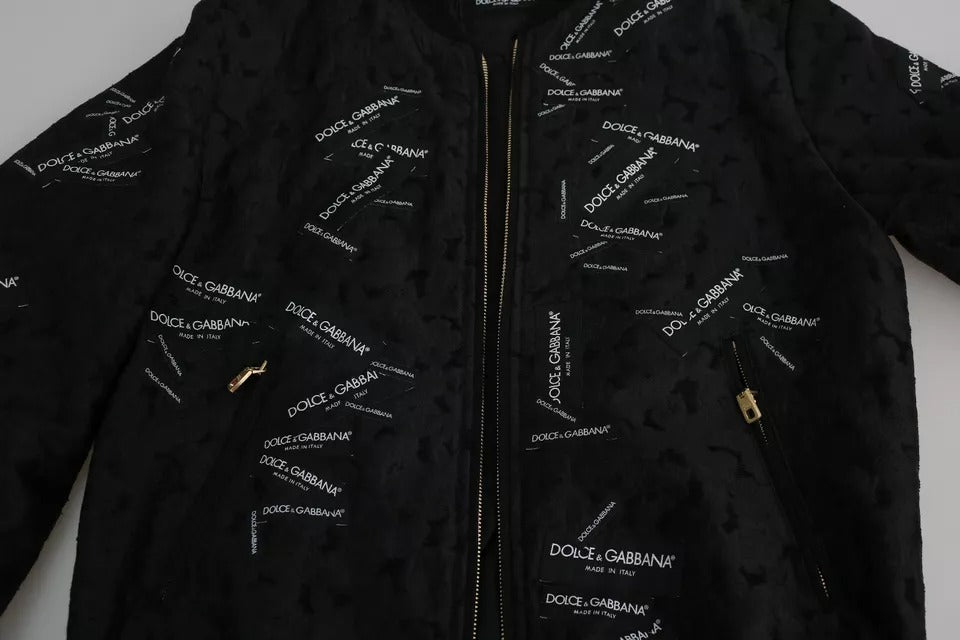 Veste bomber Dolce & Gabbana noire avec logo brodé, fermeture éclair complète et motif en brocart élégant.