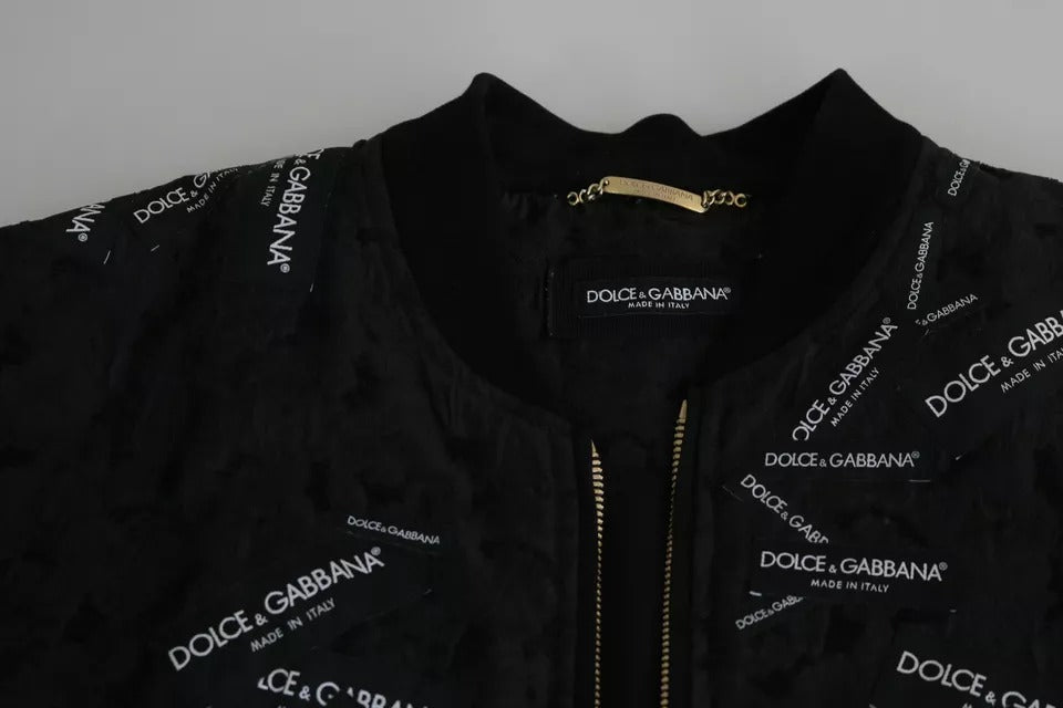 Veste bomber Dolce & Gabbana noire avec broderie, logo patch en relief et fermeture éclair complète, style élégant et sophistiqué.