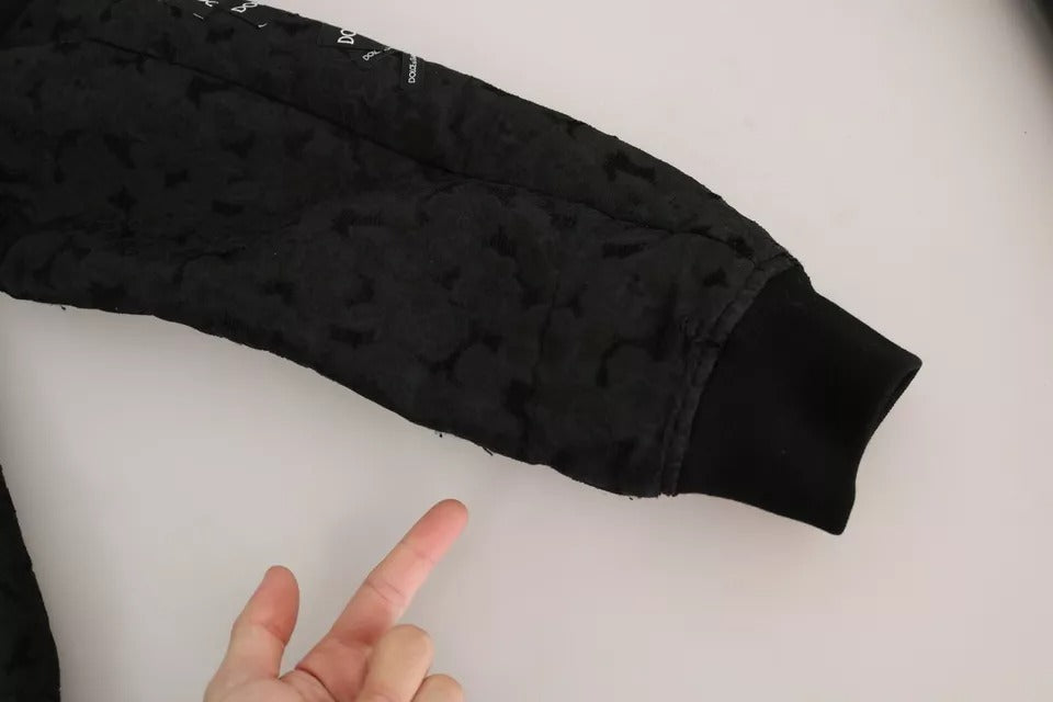 Veste bomber Dolce & Gabbana noire avec patch logo brodé, fermeture éclair complète, style élégant et moderne.