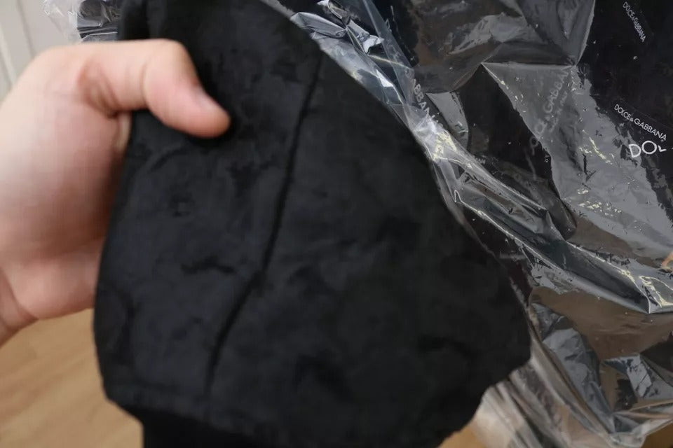 Veste bomber Dolce & Gabbana noire avec patch logo en brocard, fermeture éclair complète, style élégant et moderne.