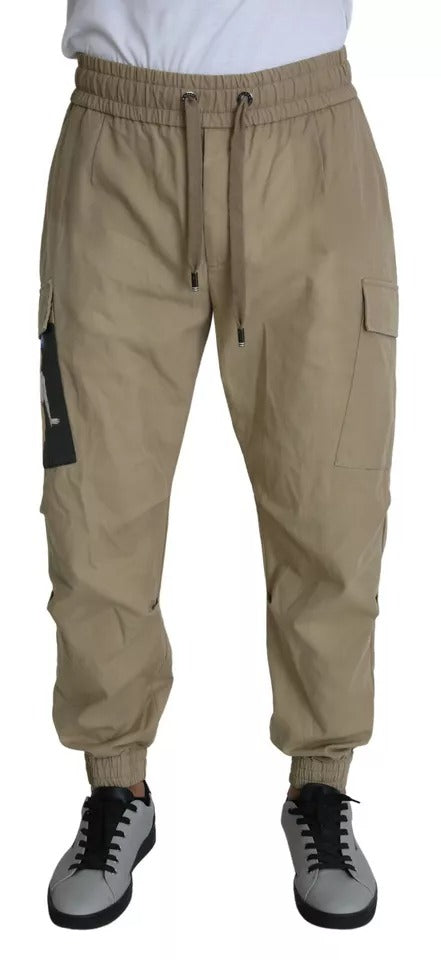 Pantalon cargo beige Dolce & Gabbana avec motif Pin Up, style décontracté et tendance, visible en gros plan.
