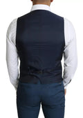 Gilet homme de costume bleu marine Dolce & Gabbana, élégant, en tissu fin, avec boutons sur le devant, porté sur un fond blanc.