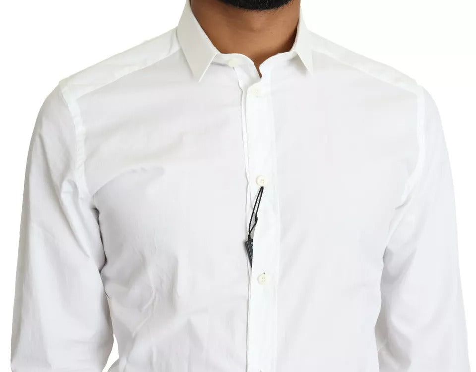 Haut de chemise formelle en coton blanc Dolce & Gabbana avec détails dorés et coupe élégante.