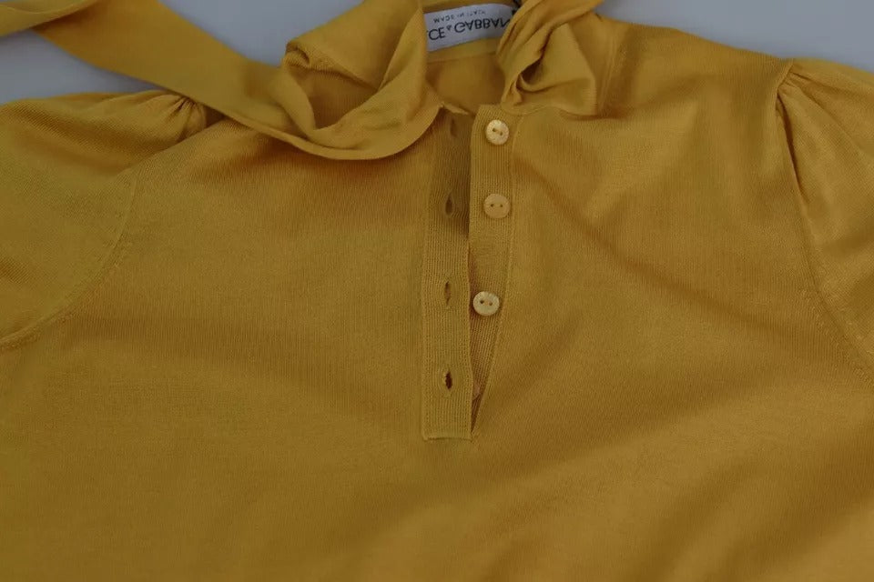 Pull en soie jaune Dolce & Gabbana avec col ascot, pull-over élégant et confortable pour un look sophistiqué.
