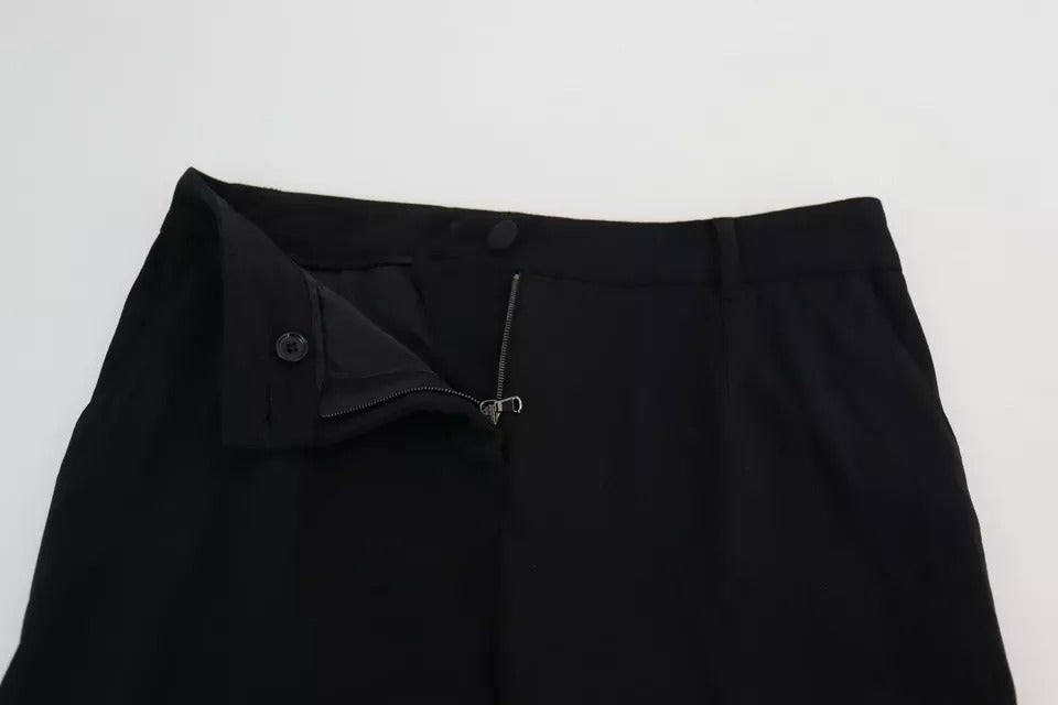 Pantalon skinny en laine vierge noire Dolce & Gabbana, coupe stretch, vue de face sur fond blanc.