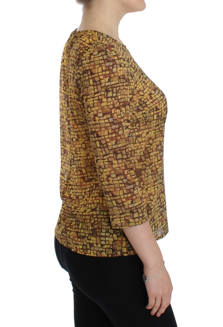 Blouse en soie Dolce & Gabbana à motif mosaïque multicolore, élégante et fluide, visible sur l'image.