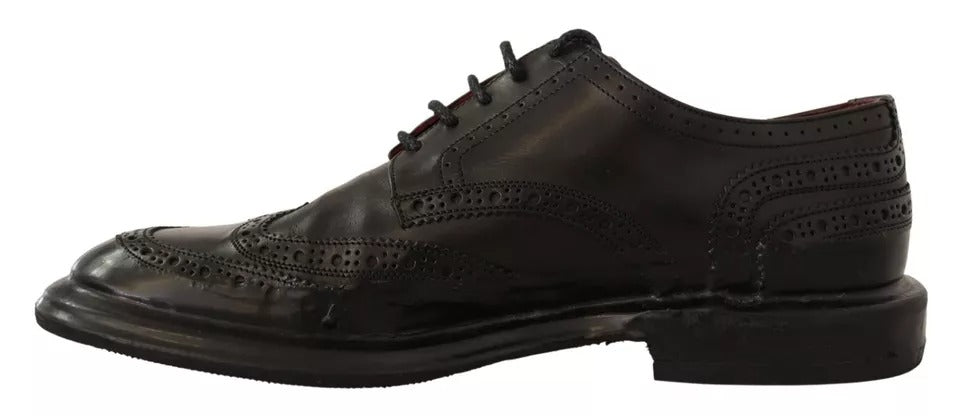 Chaussures Derby en cuir perforé noir de Dolce & Gabbana avec laçage, élégantes et sophistiquées pour homme.