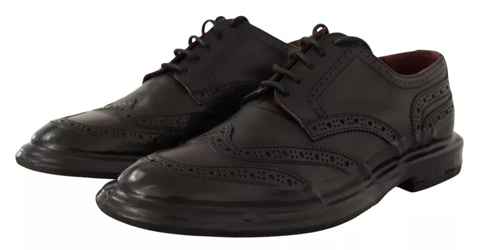 Chaussures Derby en cuir perforé noir de Dolce & Gabbana avec lacets, style élégant et sophistiqué.