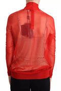 Pull à manches longues Dolce & Gabbana orange semi-transparent, en tissu léger et élégant, porté sur un mannequin.