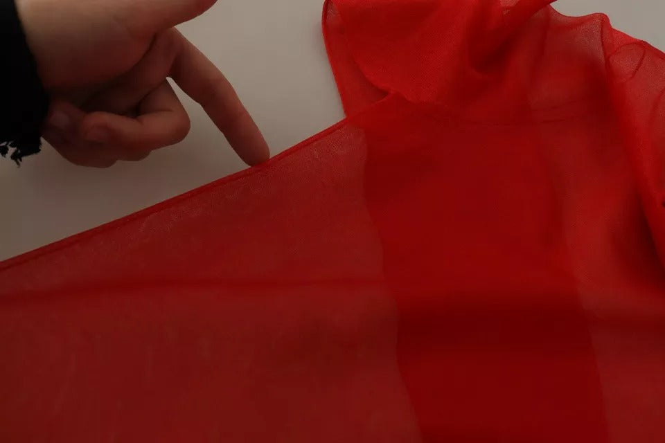 Pull léger semi-transparent orange Dolce & Gabbana avec manches longues et col en V, adapté pour un style élégant.