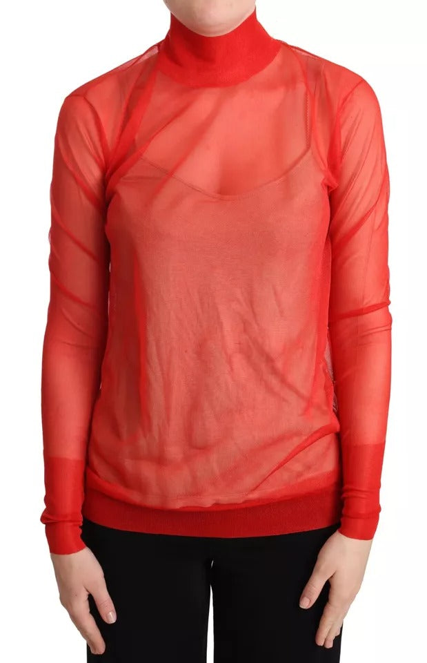 Pull semi-transparent orange Dolce & Gabbana, en maille, avec col rond et manches longues, porté sur mannequin.