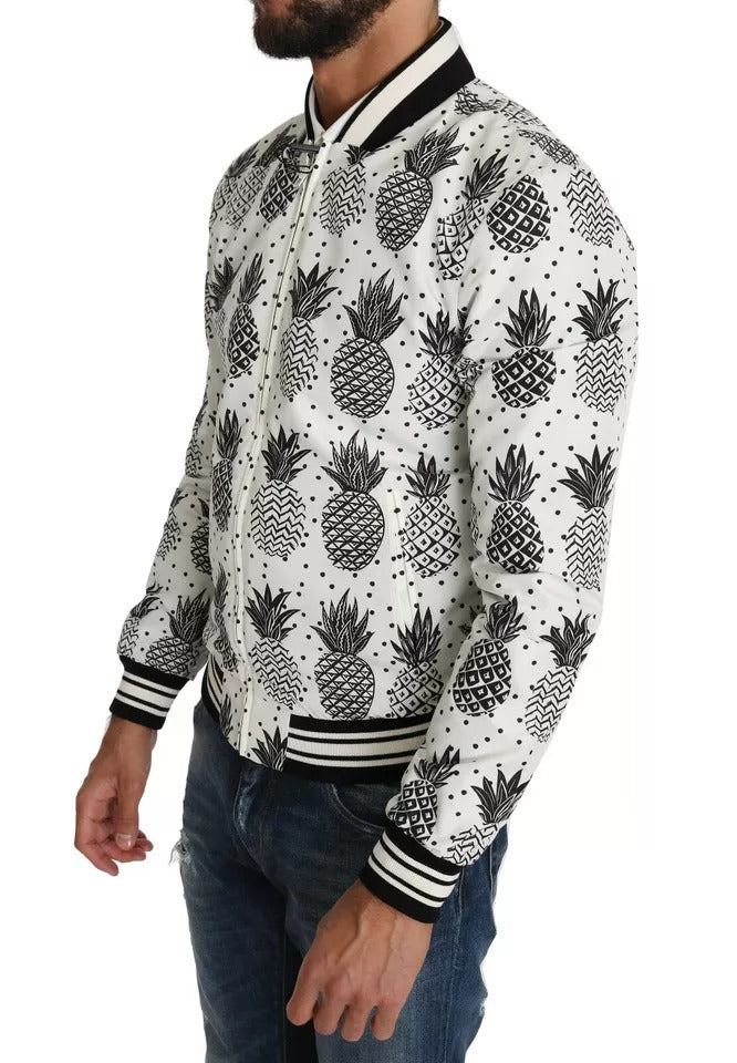 Veste bomber Dolce & Gabbana blanche et noire avec motif ananas, coupe élégante et moderne, pour un style tendance.