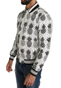 Veste bomber Dolce & Gabbana blanche et noire avec motif ananas, coupe élégante et moderne, pour un style tendance.