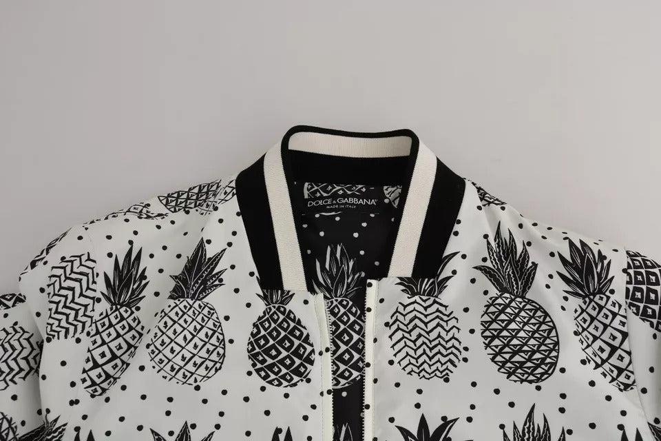 Veste bomber Dolce & Gabbana blanche et noire avec motif ananas, style moderne et élégant, vue de face.