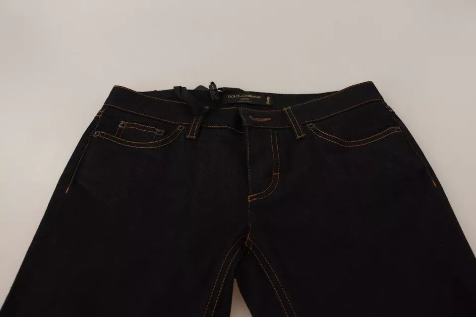 Jeans slim en denim coton stretch bleu Dolce & Gabbana, vue de face avec détails de couture et fermeture éclair visible.