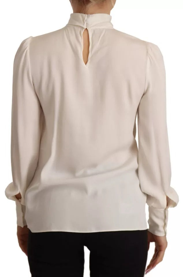 T-shirt blanc en soie Dolce & Gabbana à col roulé et manches longues, élégant et confortable.
