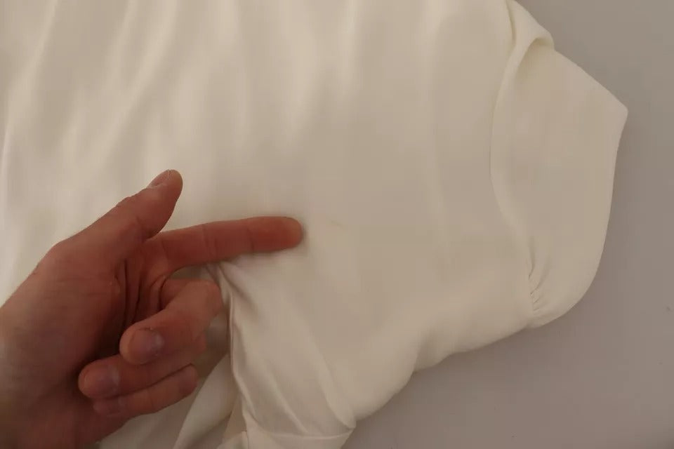 T-shirt en soie blanc cassé Dolce & Gabbana à manches longues avec col roulé, élégant et confortable.