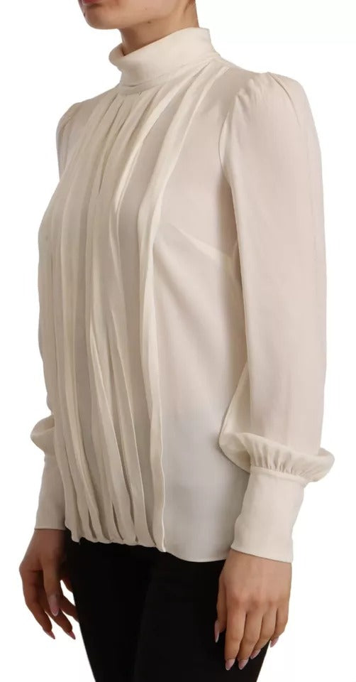 Haut en soie blanc cassé Dolce & Gabbana à manches longues et col roulé, élégance sophistiquée pour femme.
