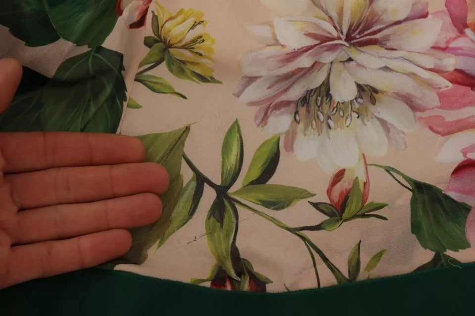 Robe longue rose à coupe trapèze et manches bouffantes Dolce & Gabbana avec motif floral et nœud en satin.