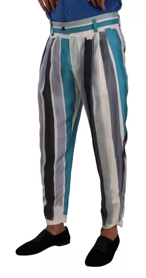 Pantalons en soie à rayures bleues de style tapered par Dolce & Gabbana, vue de face sur fond neutre.
