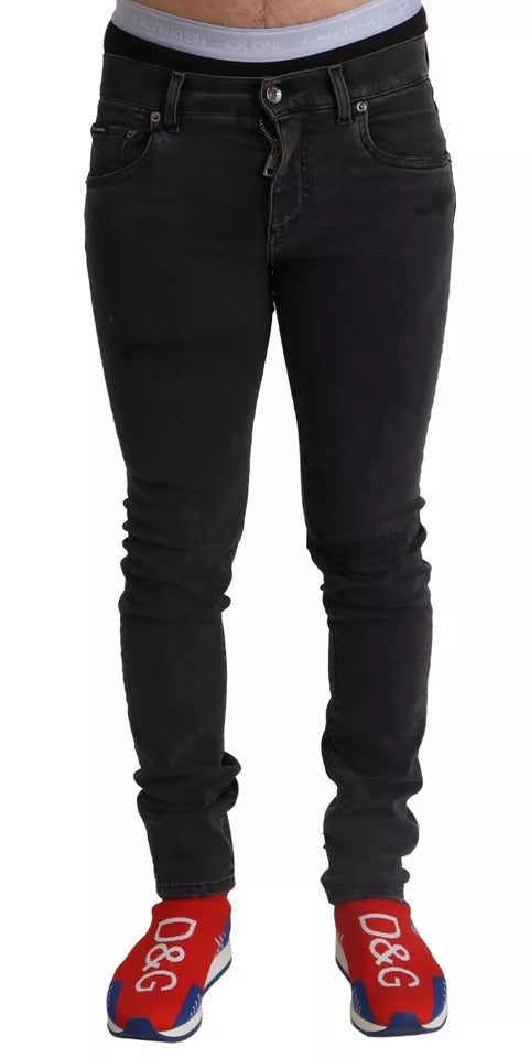 Jean skinny en denim extensible gris Dolce & Gabbana avec logo, style running, ajusté et moderne.